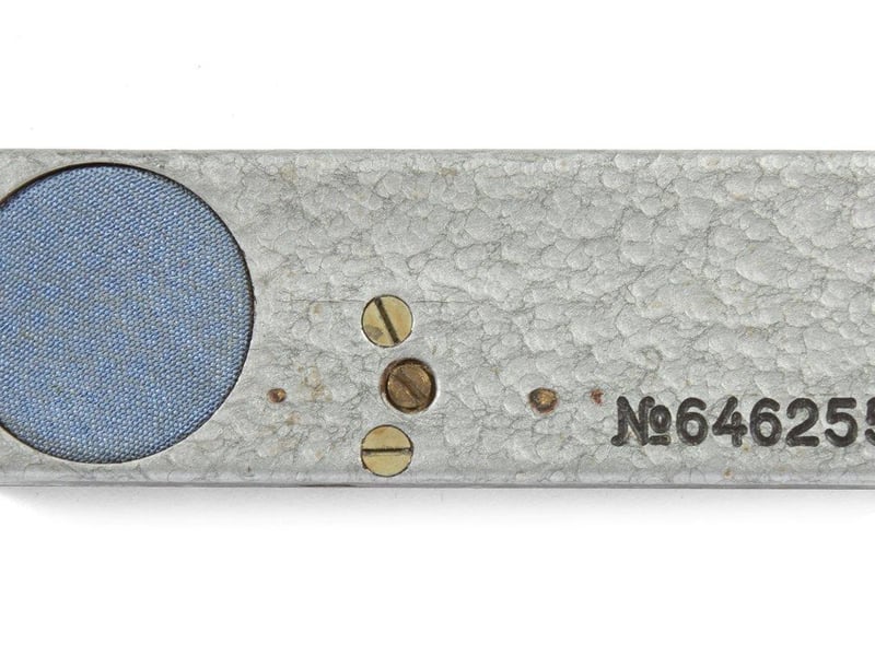 One of the first transistorized stationary microphone listening devices or "bugs" with an adjustable frequency, circa 1964. This model was often installed in hotel rooms for eavesdropping on important conversations. Estimate: $500-$700