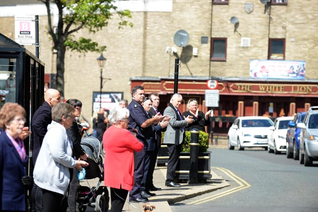 People took time out to line The Broadway as they watched the funeral procession of Sheila Quigley travel towards St Michael's and All Saints Church.