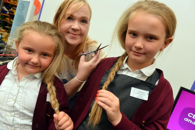 Over at Bamburgh School, this was the scene in 2016 for a charity hair cut for CLIC Sergeant. Pictured from the left are Maddie Gray, 5, with sister Holly Gray , 8, and hairdresser Katherine Daly.