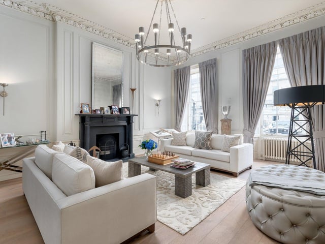 On the ground level there is a large drawing room, which is filled with an abundance of natural light from the windows to the front