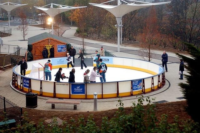 Steelers players, left to right: Rob Dopson, Ron Shudra, MarK Dutiaume along with Ron's son Cole, open the new Meadowhall Ice Rink outside the Oasis, November 11, 2003