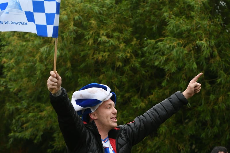 Fan cheering the Hartlepool United open topped bus parade at the junction of The Coast Road and West View Road.