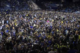 Crowds on the pitch at Hillsborough after Sheffield Wednesday beat Peterborough United. (Steve Ellis)