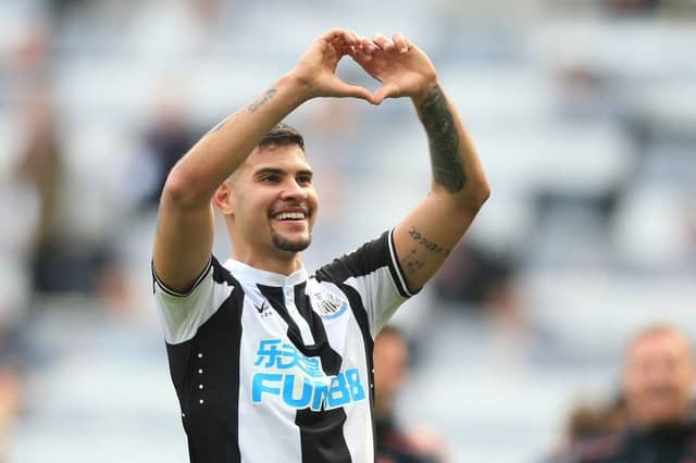 Newcastle United's Brazilian midfielder Bruno Guimaraes celebrates on the pitch after the English Premier League football match between Newcastle United and Leicester City at St James' Park in Newcastle-upon-Tyne, north east England on April 17, 2022. (Photo by LINDSEY PARNABY/AFP via Getty Images)