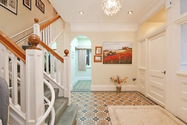 The stunning hallway has an attractive tiled floor, two walk-in store rooms and a cloakroom.