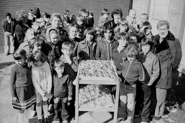 Take a trip down memory lane to 1980 
Mansfield's Old Meeting House 
Children pictured here with hot crossed buns - do you remember what for?