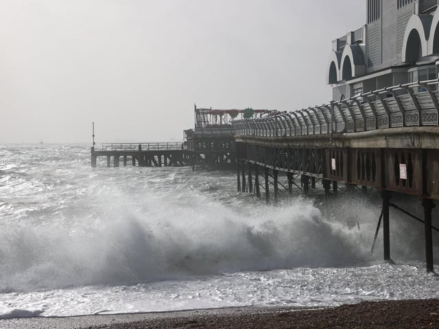 South Parade Pier saw large waves crashing against it. Photos by Alex Shute