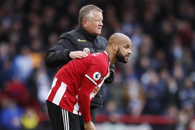 Chris Wilder, the manager of Sheffield United, with David McGoldrick: Simon Bellis/Sportimage
