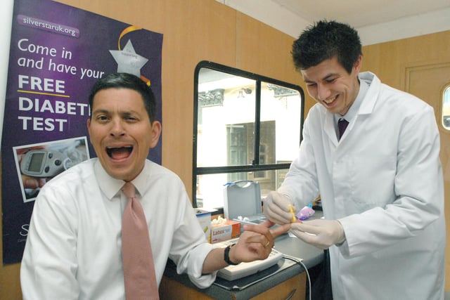 David Miliband was pictured as he took a diabetes test at the Silver Star testing van and shared a joke with nurse George Krupka during his test.