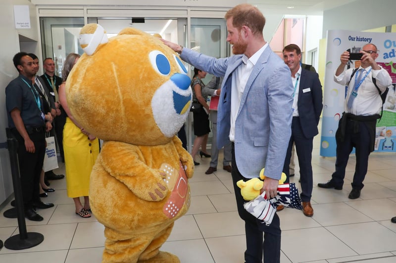 Prince Harry, Duke of Sussex meets the hospital's mascot, Theo the bear, during his visit to Sheffield Children's Hospital