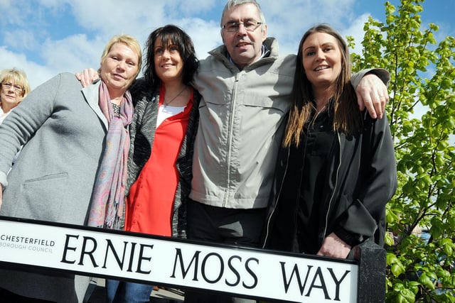 Moss with his wife, Jenny, left, and daughters Nikki Trueman and Sarah Moss after unveiling his street sign.