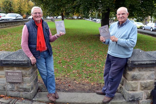 John Austin and John Cornwell, with the book, produced by Nether Edge History Group, about the history people and buildings of Nether Edge.