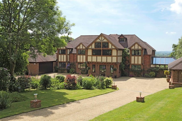 Enjoying a wonderful rural location in an Area of Outstanding Natural Beauty, this substantial country house has been designed and finished to an exceptional standard, and features its own cinema, games room and tennis court. Price: £3,650,000.