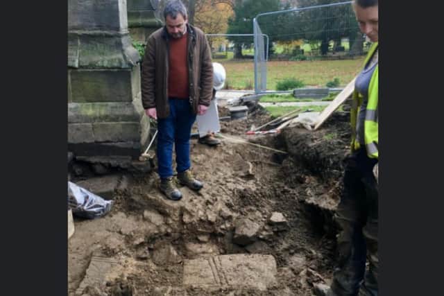 Dr Hugh Willmott of the University of Sheffield’s Department of Archaeology, looks at the cross in situ after its discovery