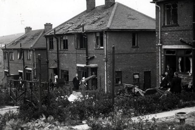 Families in Shiregreen get their homes - and lives - back together after the Blitz blast damage left these homes with shattered windows and crumpled tiles.