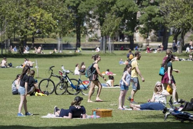 Families relax in the Meadows and enjoy socially distant picnics. Photo: Jane Barlow/PA Wire