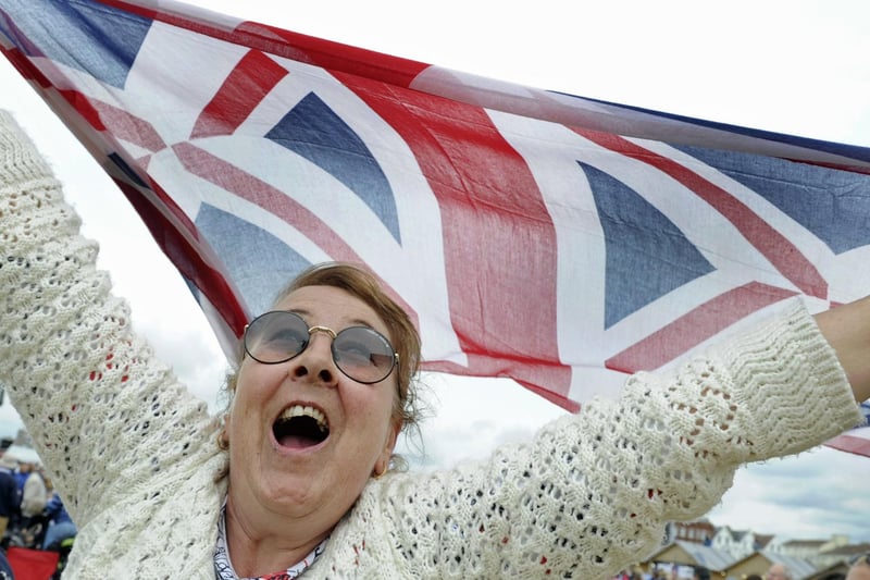 Crowds enjoy the D Day celebrations on Southsea Common: Georgina Cooper from Portchester waves the Union Jack. Picture: Ian Hargreaves (050619-25)