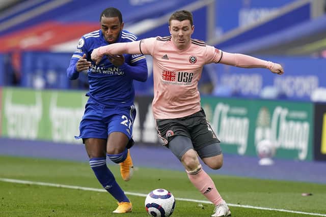 Ricardo Pereira of Leicester City tussles with John Fleck of Sheffield United at the KP Stadium on Sunday: Andrew Yates/Sportimage