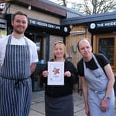The Hidden Gem Cafe has won Restaurant Guru's 'recommendation badge'. Pictured is chef Sam, assistant manager Abi, and Jonathan with the award.