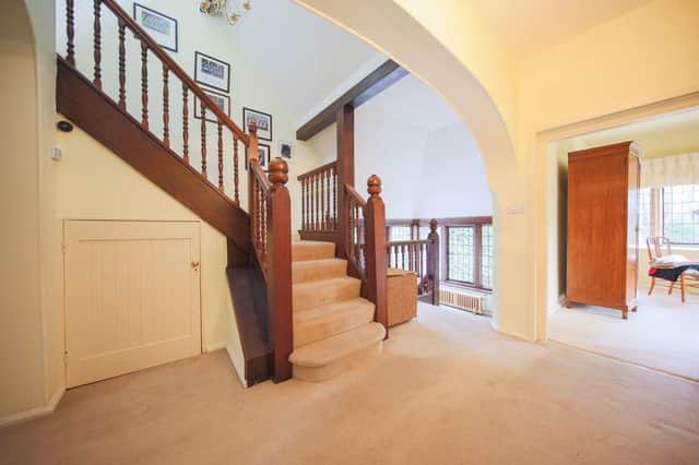 The house has an imposing staircase.