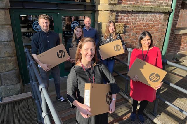 Tapton School headteacher Kat Rhodes, front, and deputy-headteacher Harkiran Grewal, right, with director Chris Booker, rear, and team at DeeperThanBlue, which has donated 15 laptops to the school.