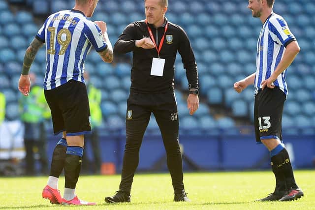 Owls Manager Garry Monk with Connor Wickham and Julian Borner. Pic Steve Ellis.