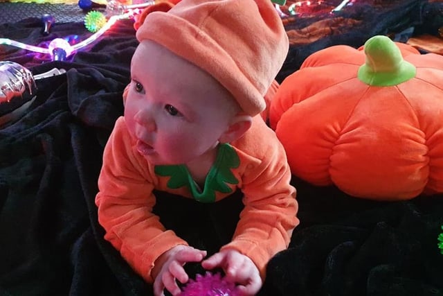 Thea looking a treat in her pumpkin outfit!