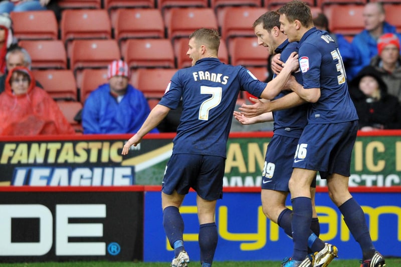 Steve Howard celebrates with his team mates after scoring the opening goal of the game in the 3-2 win over Sheffield United in 2012.