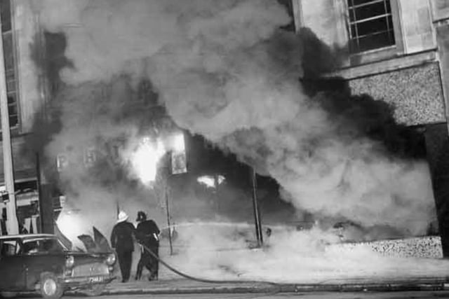 Firefighters tackle a large blaze at Phillips Furnishing Stores Ltd on The Moor on March 15, 1965