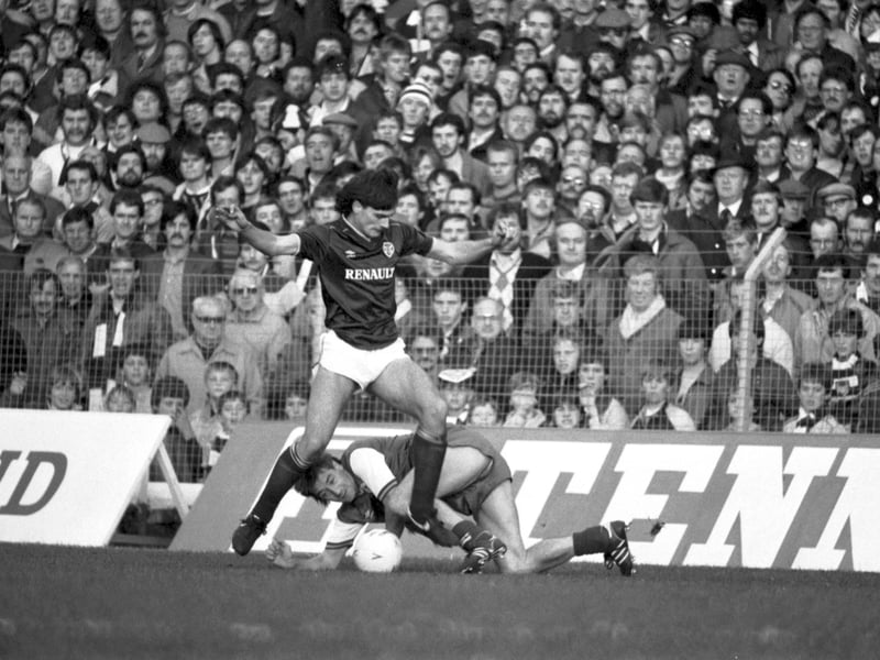 Hearts' Craig Levein manages not to stand on Hibs' Willie Irvine during a Hearts v Hibs Edinburgh derby football match at Tynecastle in October 1984.