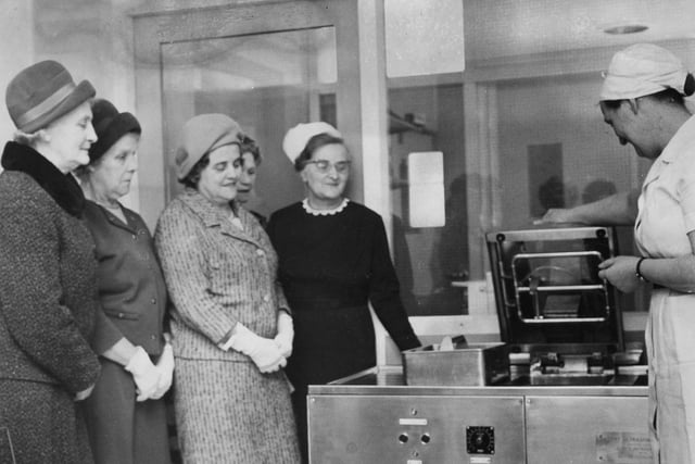 A scene from April 1968 with Sister L Gladman, sister-in-charge of the operating theatre, showing the new ultra sonic instrument washer to members of the Ingham Infirmary Ladies Guild.
