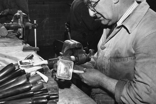 Expert at producing carving knives with buffalo horn handles at his work bench, Lewis, Rose and Co.Ltd, cutlery manufacturers, Debesco Works, Bowling Green Street. Ref no s34004