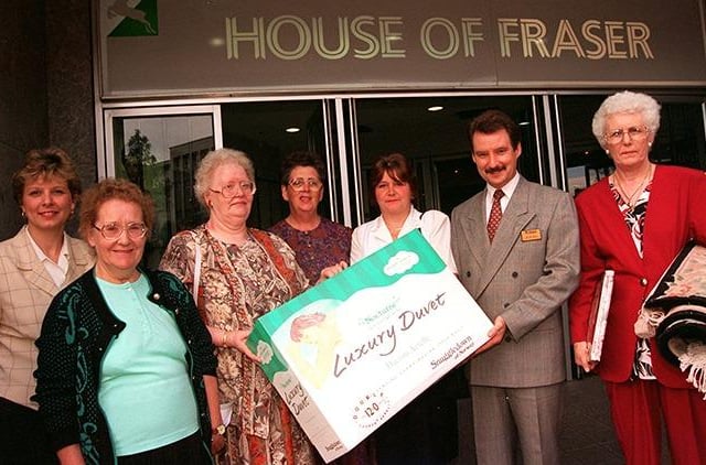House of Fraser competition winners receiving their prizes from personnel manager Colin Cave. From left are, Dawn Leaman of House of Fraser, and winners, Irene Allen, Margaret Wright, Maureen Green, Julie Mangles and Anne Grey in September 1996