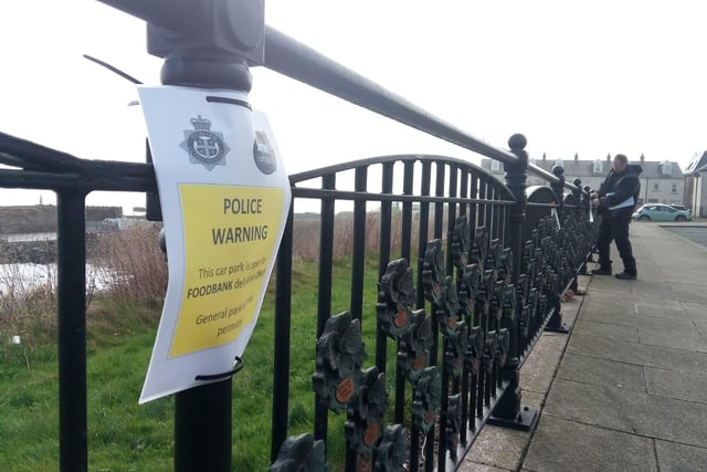 Signs have been put up around the Terrace Green, asking people not to use its car parking spaces, as police and council teams work to support a food bank project.