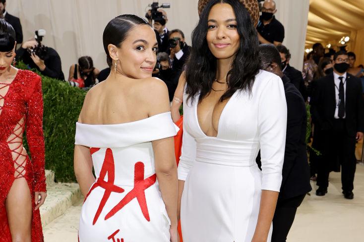Alexandria Ocasio-Cortez, in her Met Gala debut appearance, wore a Brother Vellis white gown with “Tax the Rich” written in red across her back.