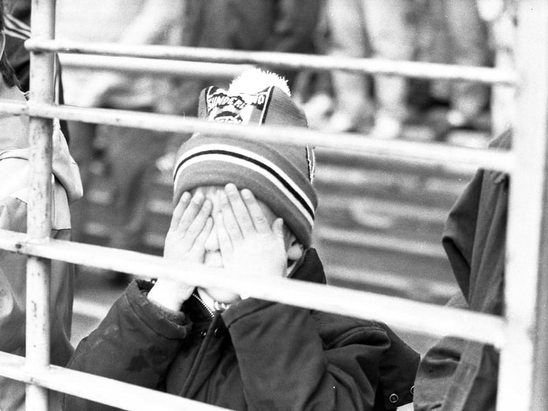 A fan at the same game cannot believe what they are watching as the club are relegated to the third tier for the first time in their proud history.