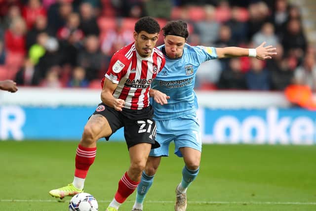 Morgan Gibbs-White of Sheffield United and Callum O'Hare of Coventry City during the Sky Bet Championship match at Bramall Lane: Simon Bellis / Sportimage