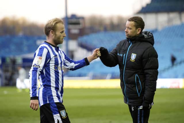 Barry Bannan is congratulated by stand-in boss Jamie Smith after a classy performance against Cardiff City.