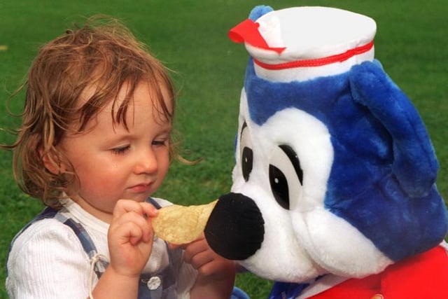 Sarah Louise Hoyland aged two feeding her teddy bear a crisp in Sandall Park in 1997.