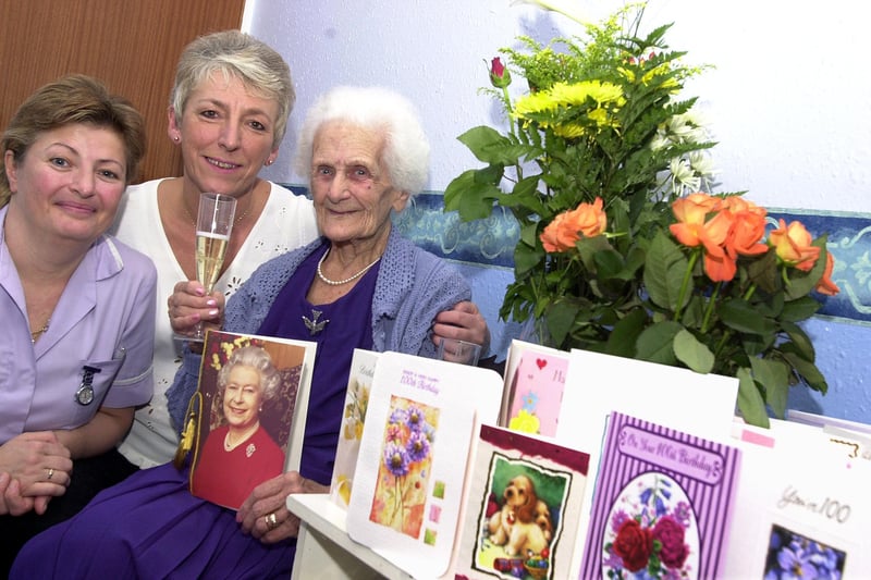 Mary Bednall, better know as Alice Bednall, celebrated her 100th birthday at St Mary's Nursing Home, Thorne Road, Doncaster,  in 2003 with care assistant Brenda Taylor and activities co-ordinator Jackie Leese.