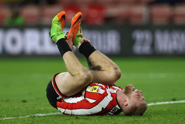 Sheffield United's Oliver McBurnie of Sheffield Utd shouts out in pain after falling awkwardly: Darren Staples / Sportimage