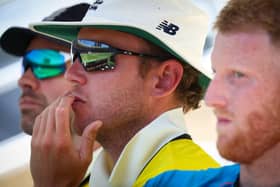 England's players Jimmy Anderson (L), Stuart Broad (C) and Ben Stokes look on during day four of the first Ashes cricket Test match between England and Australia at the Gabba (Photo by PATRICK HAMILTON/AFP /AFP via Getty Images)