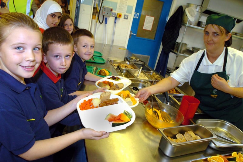 Cook Stacey Evison serves school council members, l/r: Josie Ibbotson(8), Elliot Reynolds and Luke Rowland(both 9) at Marcliffe Primary School, Hillsborough in 2006