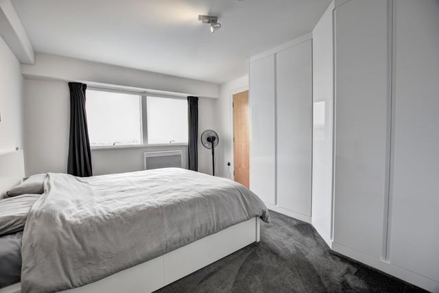 The main bedroom has a comprehensive range of quality fitted wardrobes