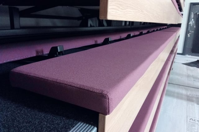 A close up picture of the retractable seating in the lecture theatre
