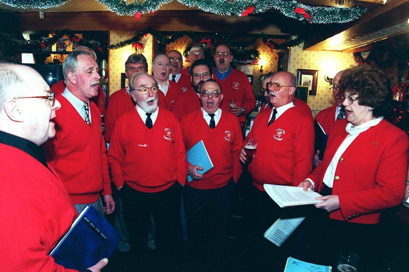 Sheffield has a unique tradition of singing traditional local Christmas carols, different to the ones you get at Church, in local pubs. It is said that the communities started singing them in the pubs, because, back in history, the clergy would not have these versions of the carols in their churches. This pictures shows singers at the Cock Inn, Oughtibridge, where the Worrall Male Voice Choir was singing Christmas carols in the bar. Picture: Mike Waistell, Sheffield Newspapers