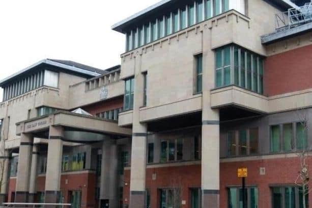 Gary Cartlidge, aged 48, of Martin Street, Upperthorpe, Sheffield, was jailed at Sheffield Crown Court, pictured, for 12 months after he admitted causing damage and threatening a woman with an offensive weapon at the Wicker Pharmacy, in Sheffield.