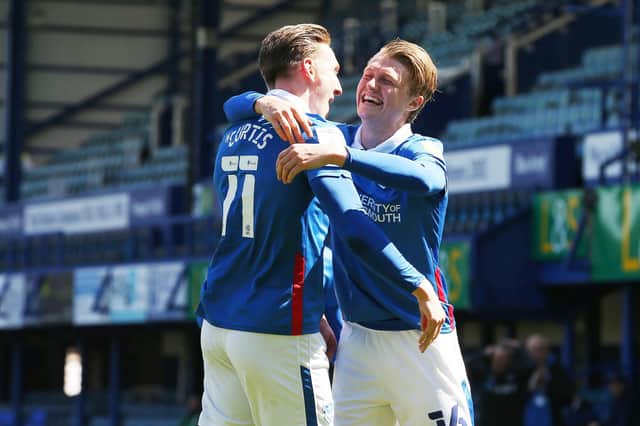 Ronan Curtis celebrates with George Byers after the pair combined for Pompey's winner.