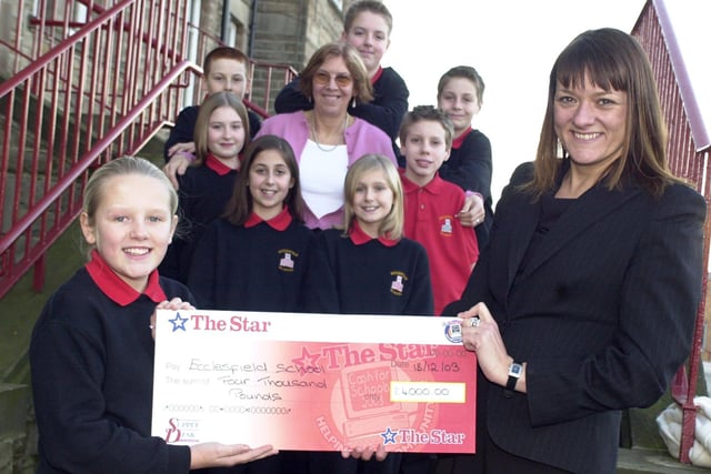 Ecclesfield School, £4,000 Cash For Schools second place: Kids receiving cheque from Star Promotions Events manager Moira Kelly - with school teacher Margaret Davies in 2003