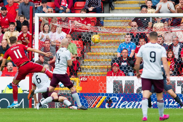 A late Ryan Hedges strike earned Aberdeen all three points after Hearts led 2-1 in the second half.